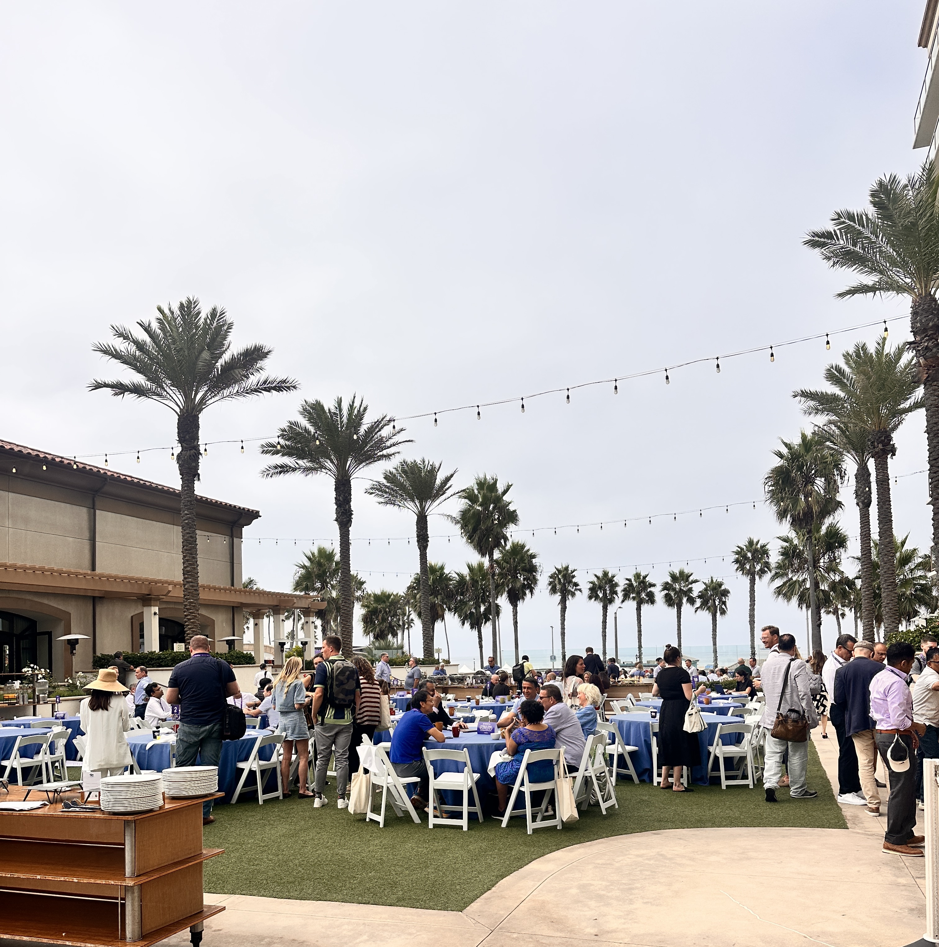 Attendees at the beachfront courtyard in Huntington Beach